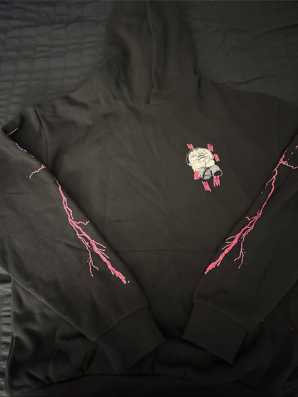 Black Hoodie with Pink Lightning and Cartoon Graphic
